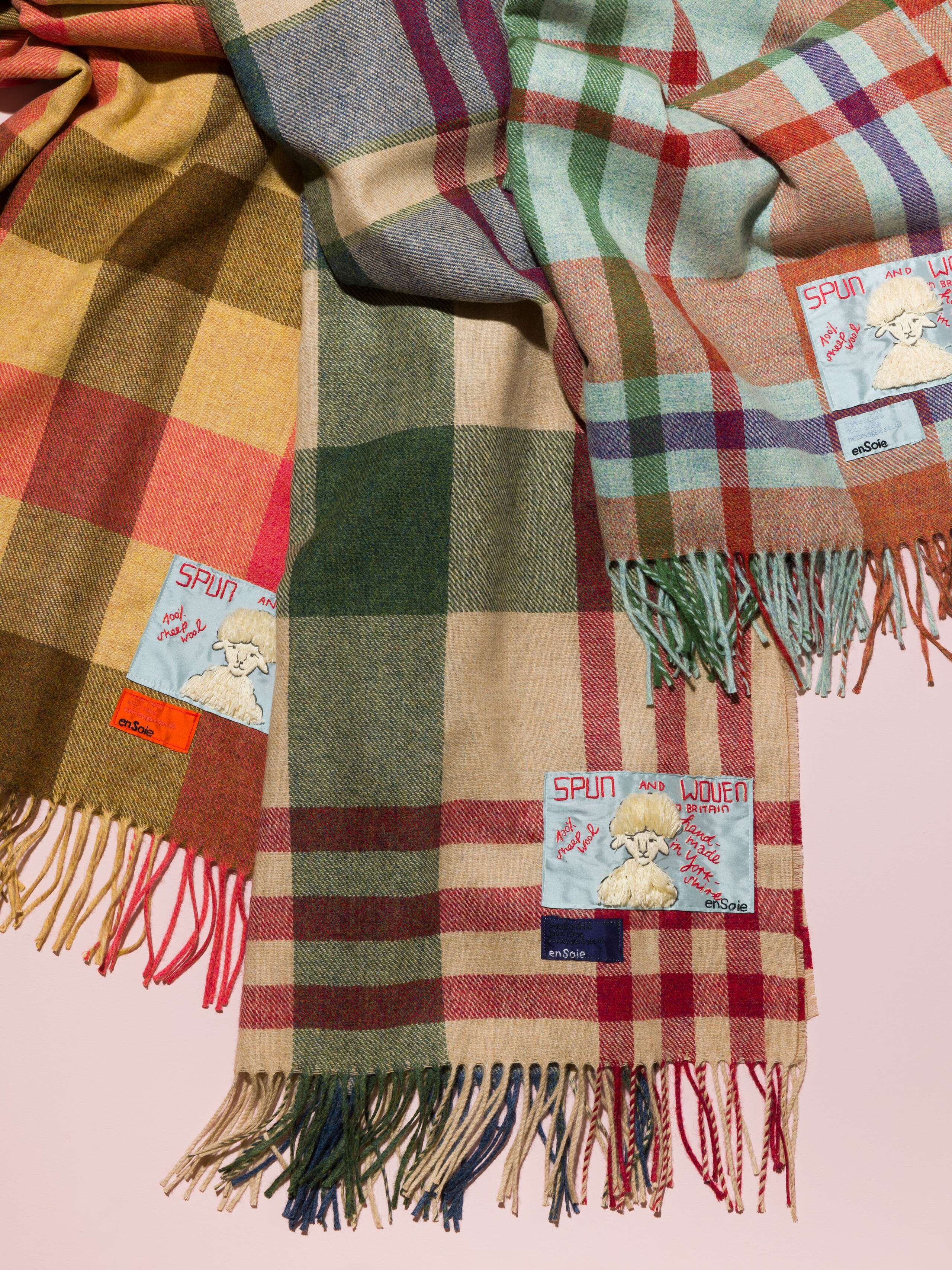 Picture of three colourful handmade wool blankets