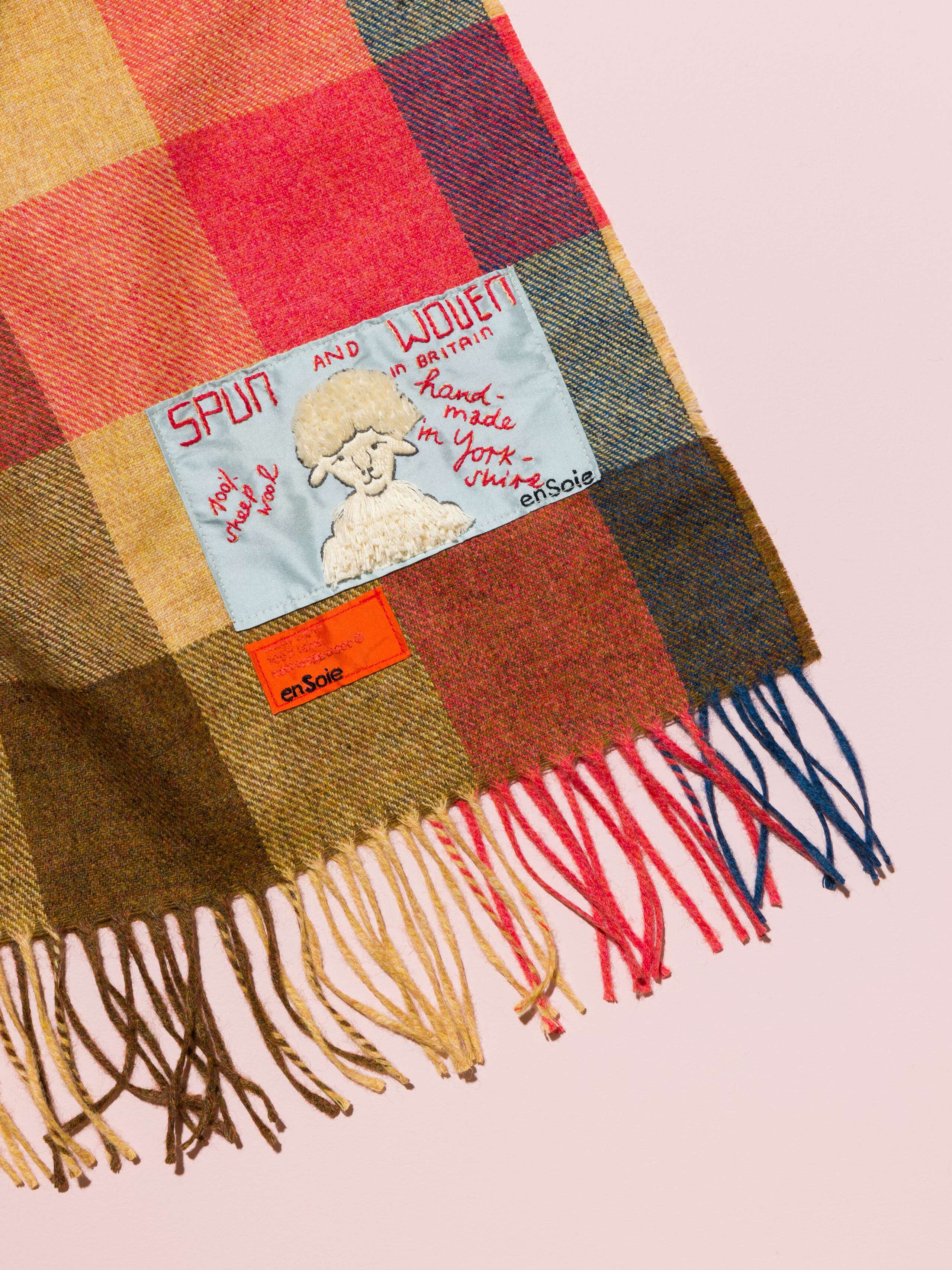Picture of a woven wool blankets in bright colours