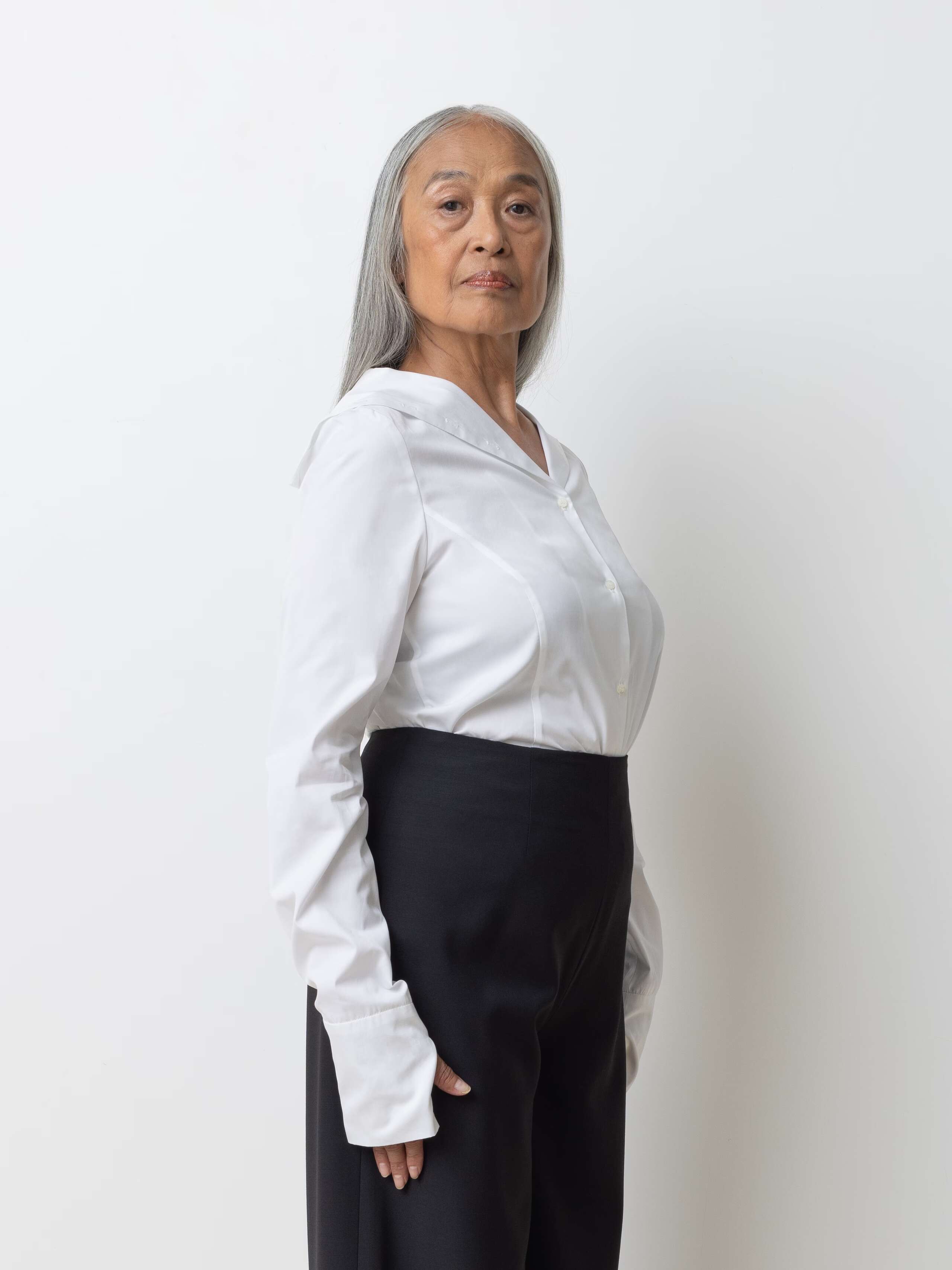 Picture of a model wearing a white cotton shirt
