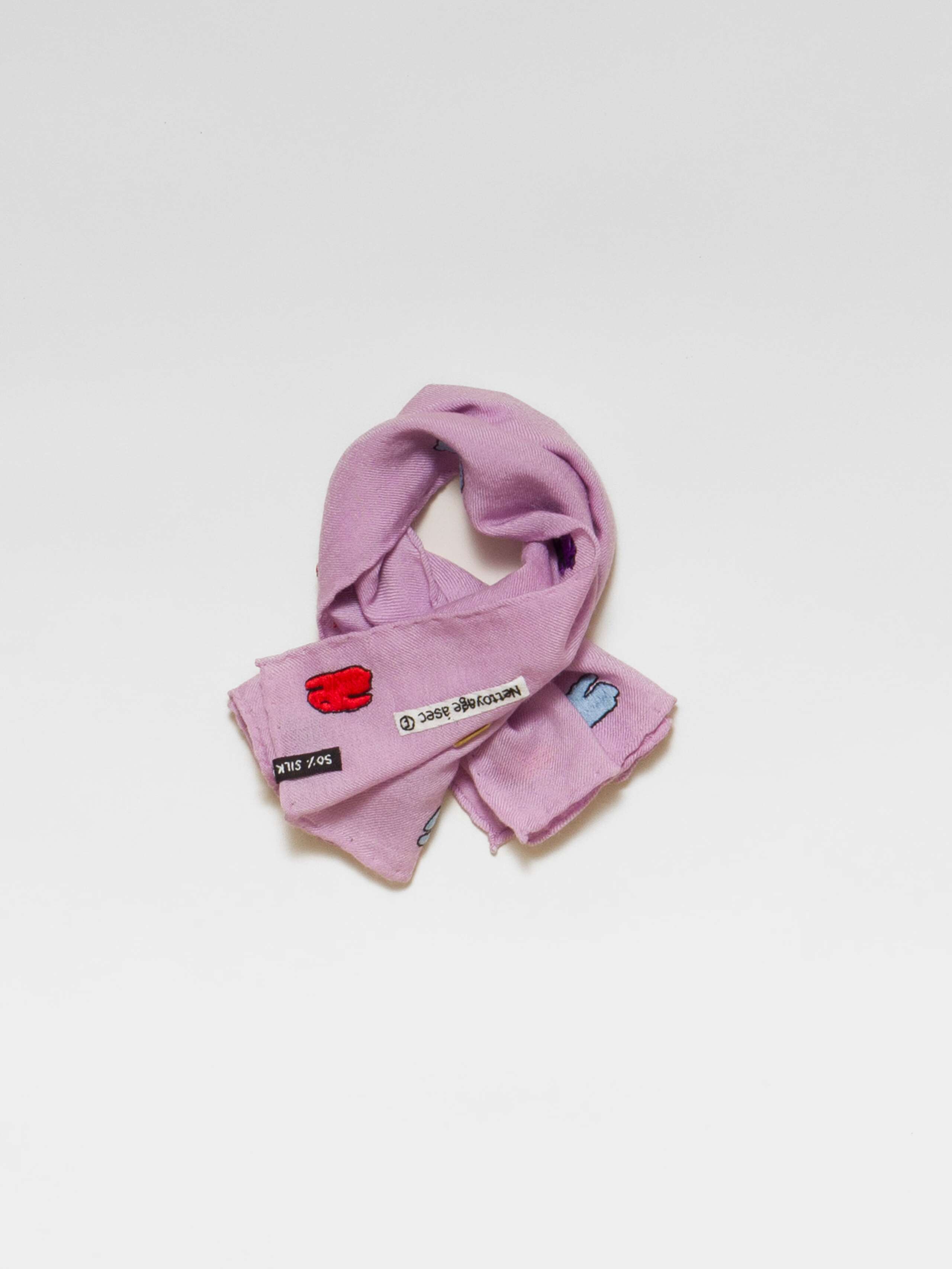 Picture of a lavender wool silk scarf featuring a cute rabbit embroidery