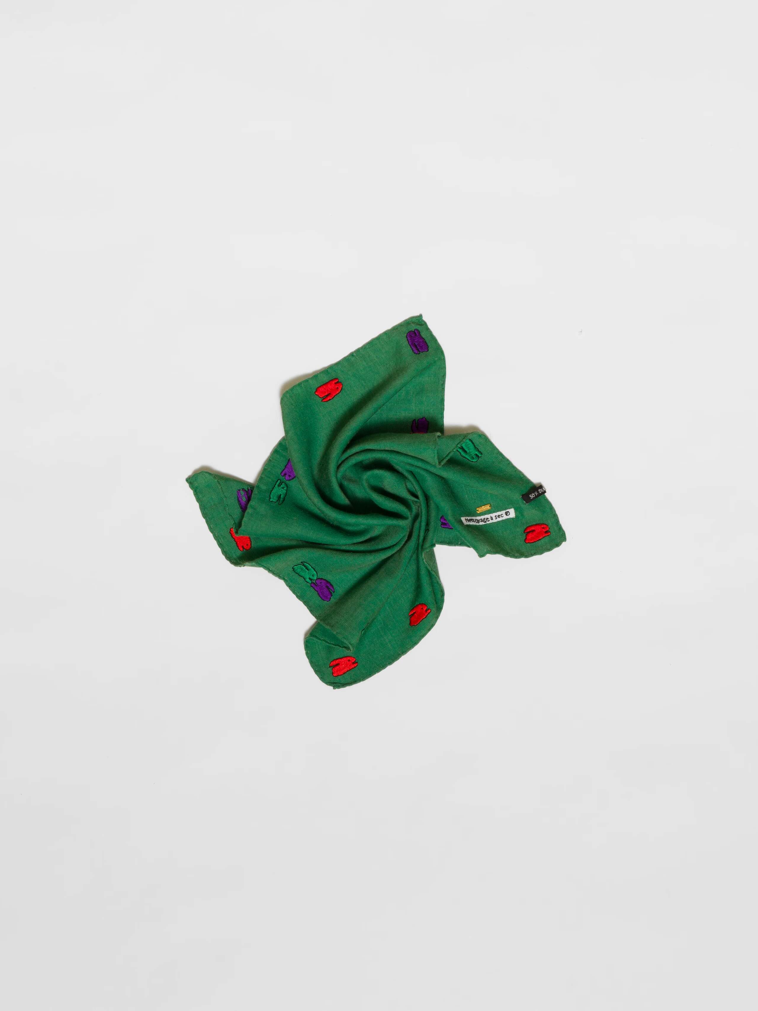 Picture of a green wool silk scarf featuring a cute rabbit embroidery