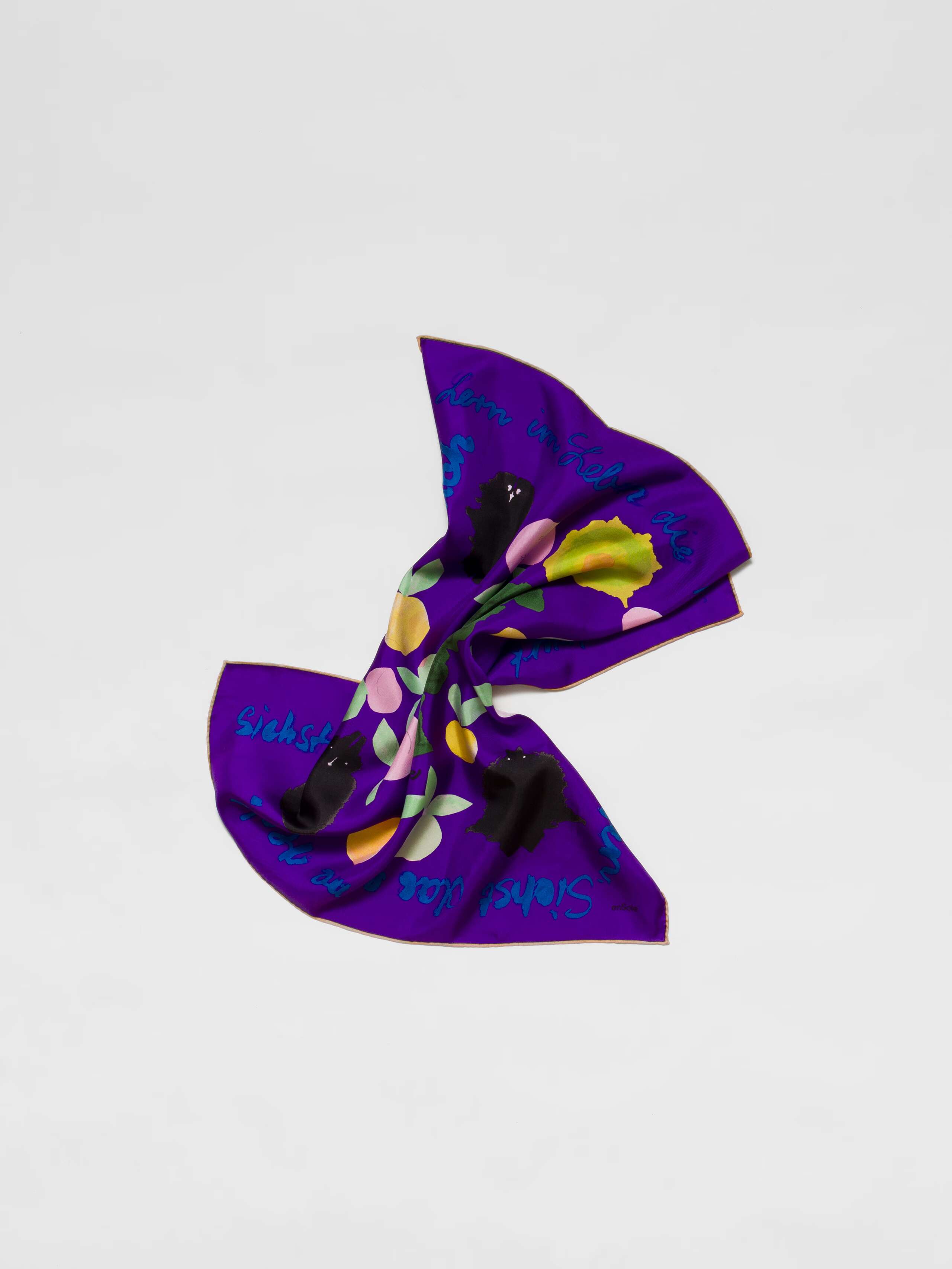 Picture of a purple silk foulard featuring a colourful apple print