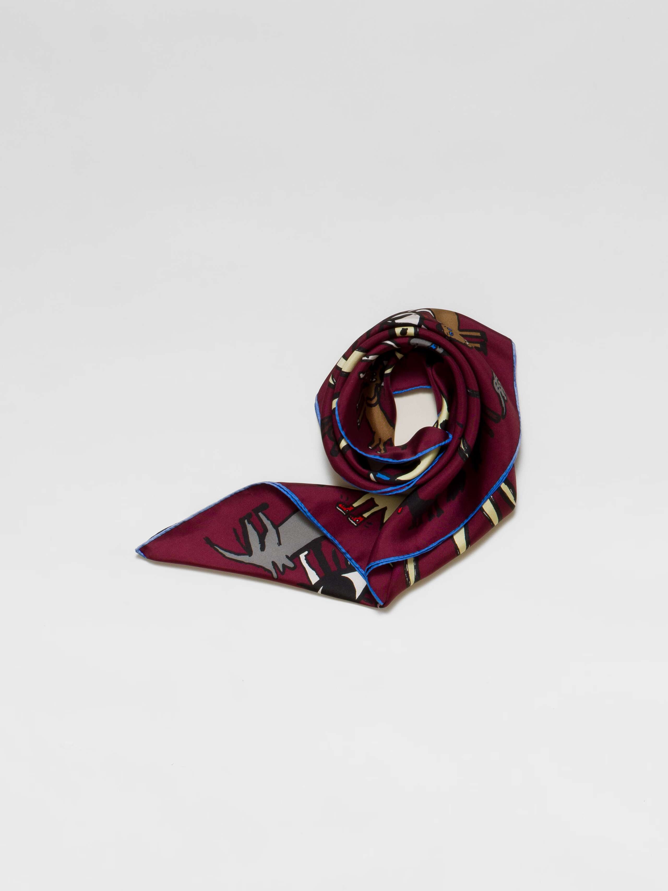 Picture of a burgundy silk foulard featuring a sun and lots of funny, colourful creatures 