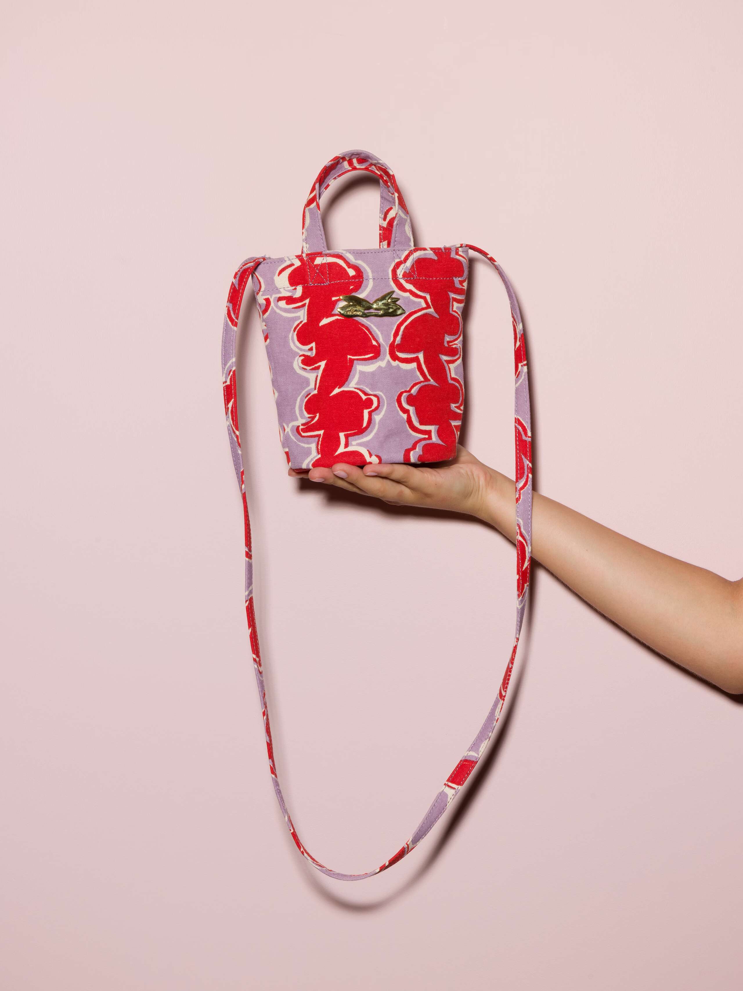 Picture of a small cotton canvas bag featuring a red rabbit print 