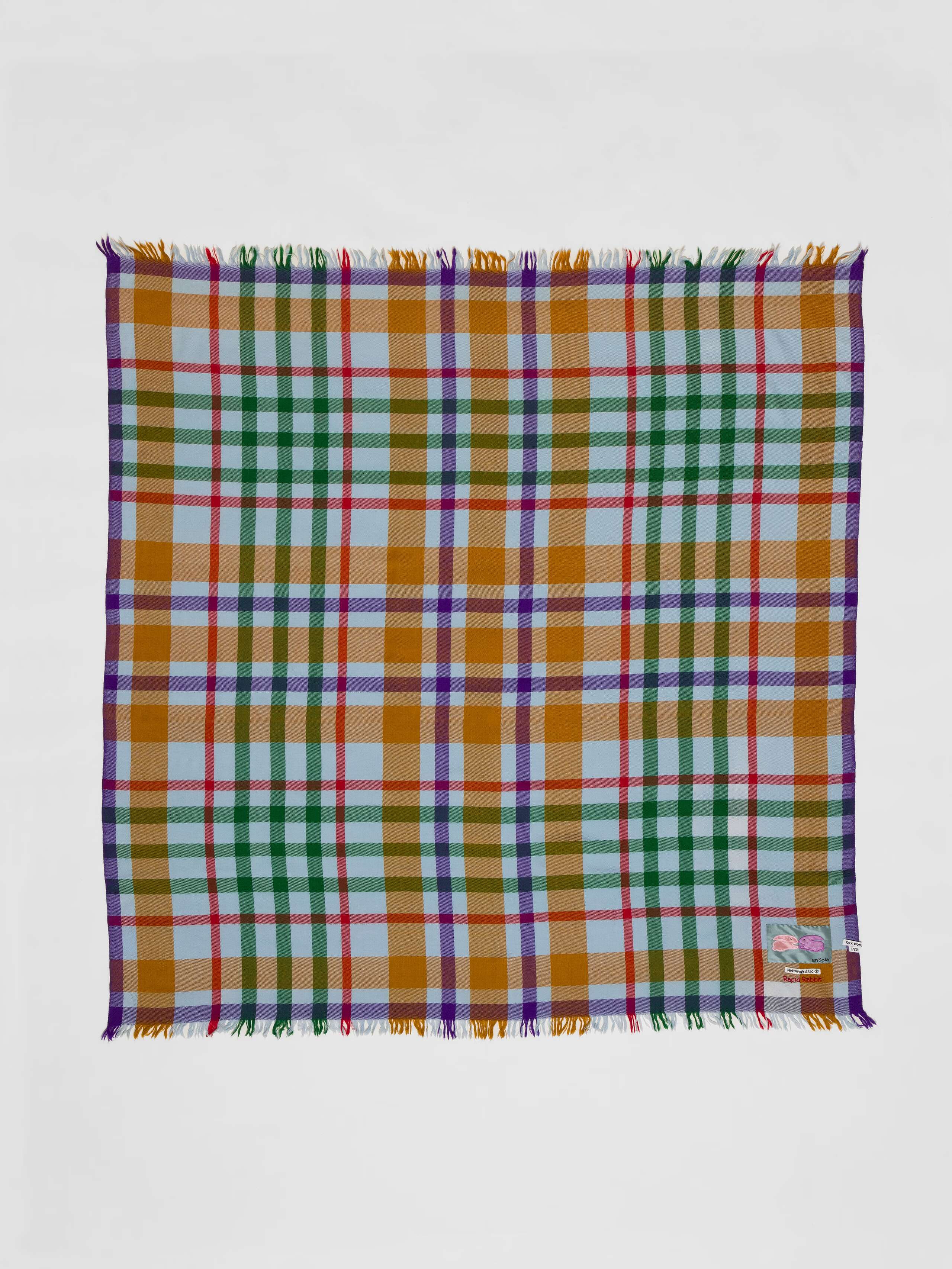 Picture of a colourful wool scarf in brown, purple, red and blue shades