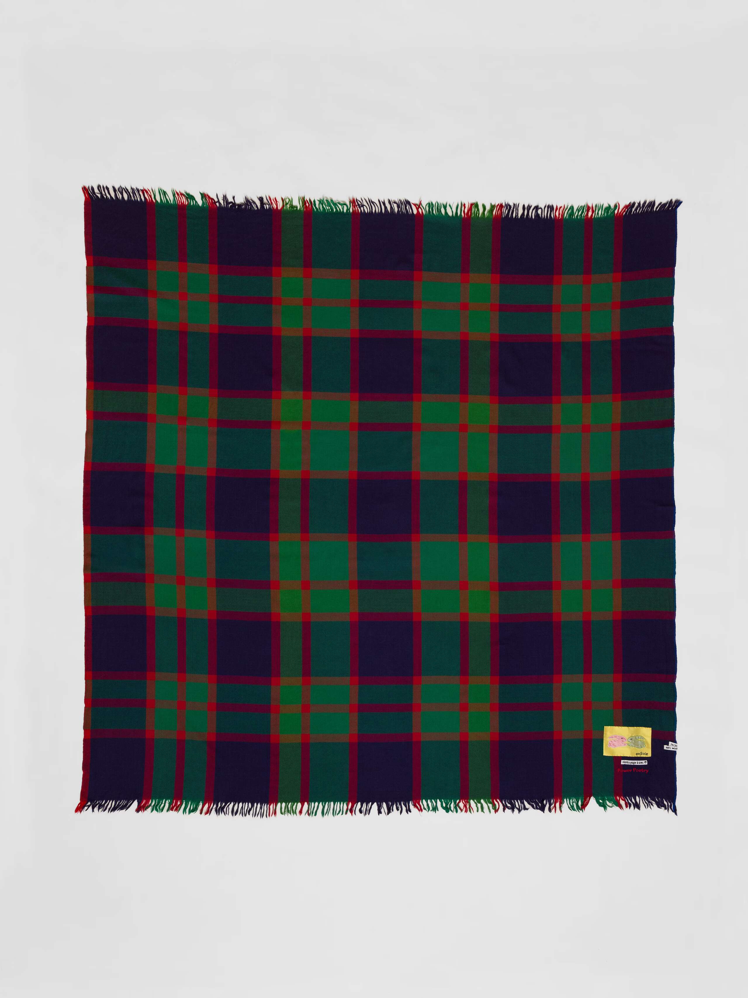 Picture of a colourful wool scarf in purple, red and green shades