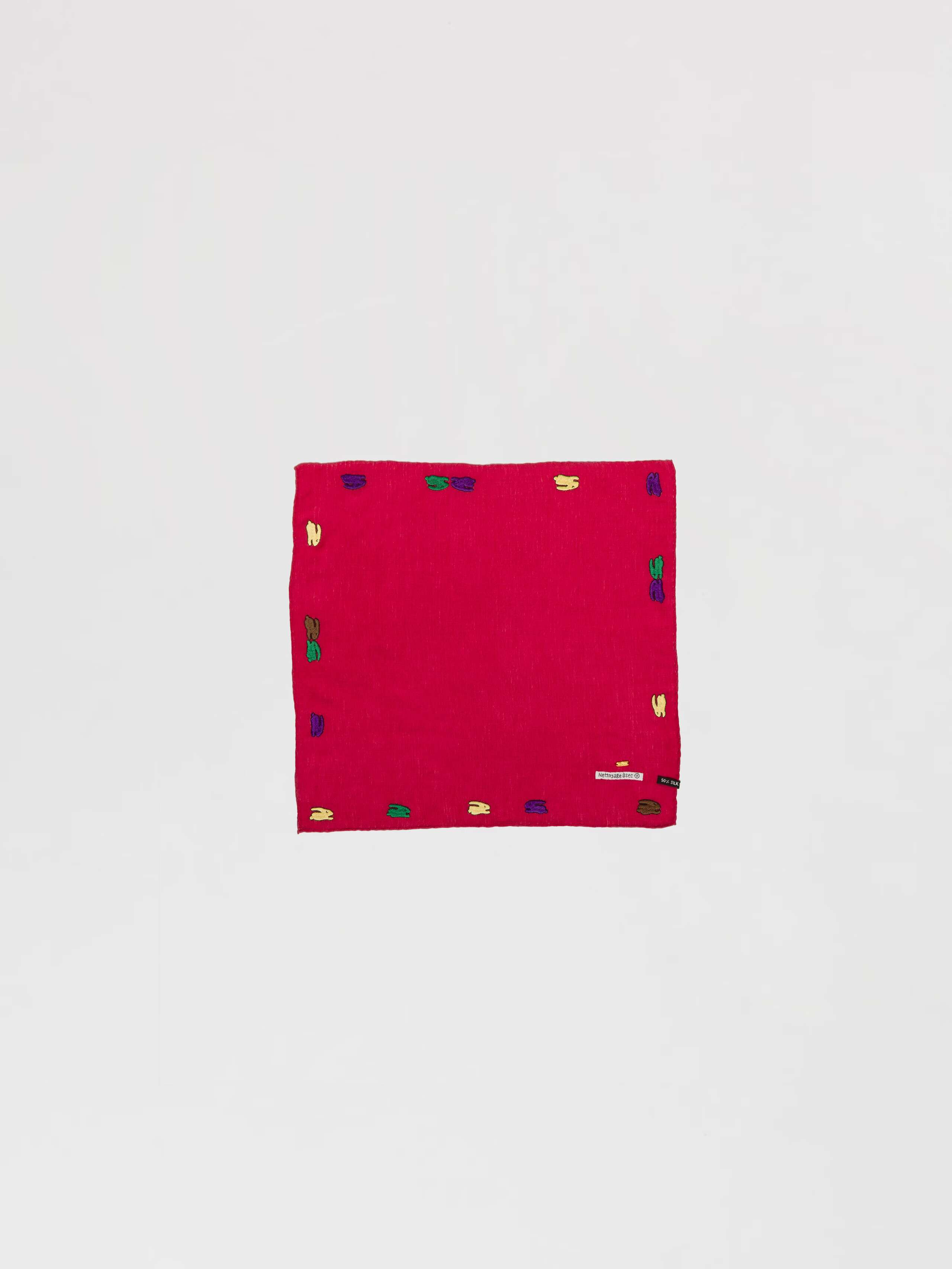 Picture of a red wool silk scarf featuring a cute rabbit embroidery