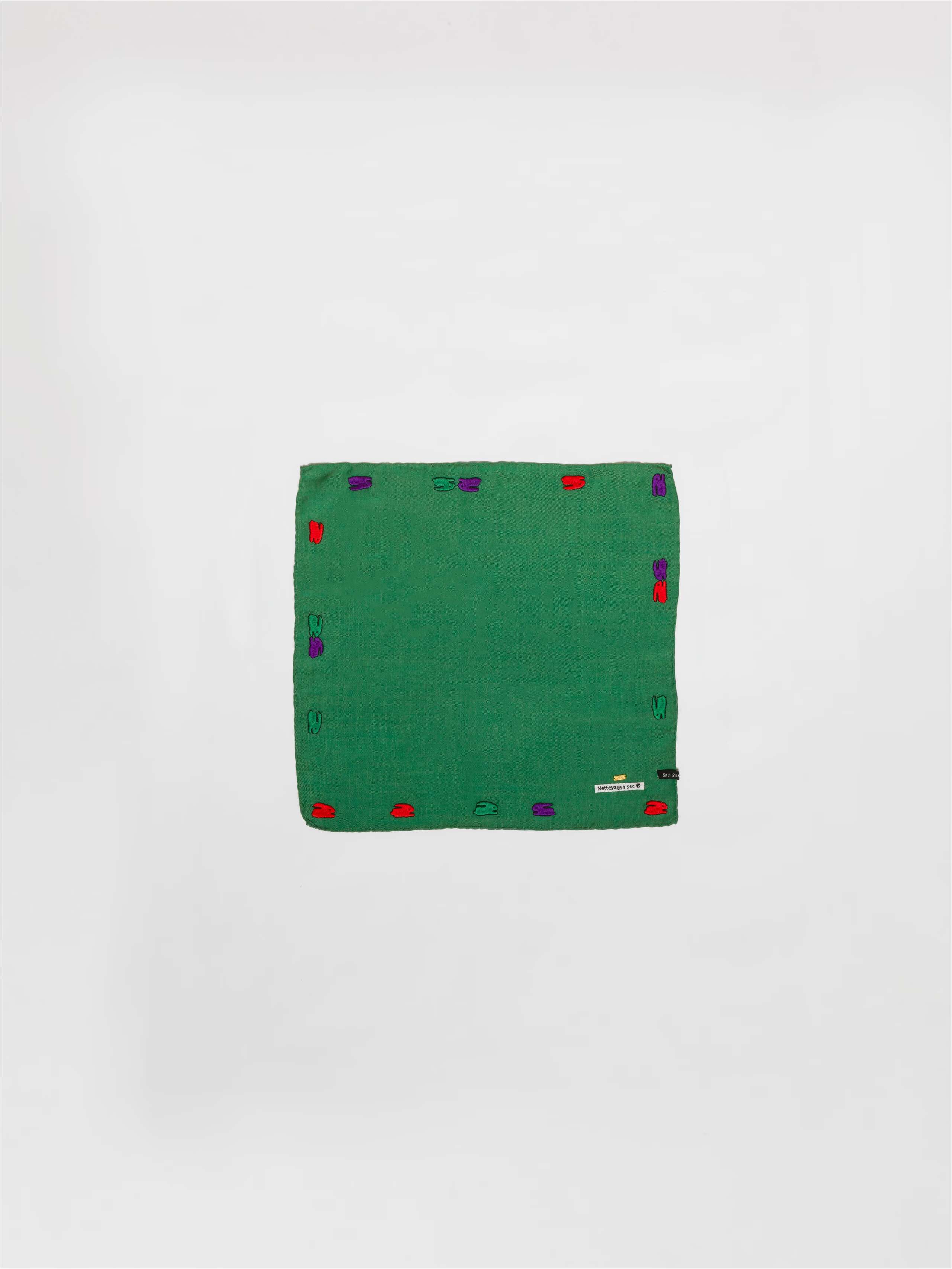 Picture of a green wool silk scarf featuring a cute rabbit embroidery