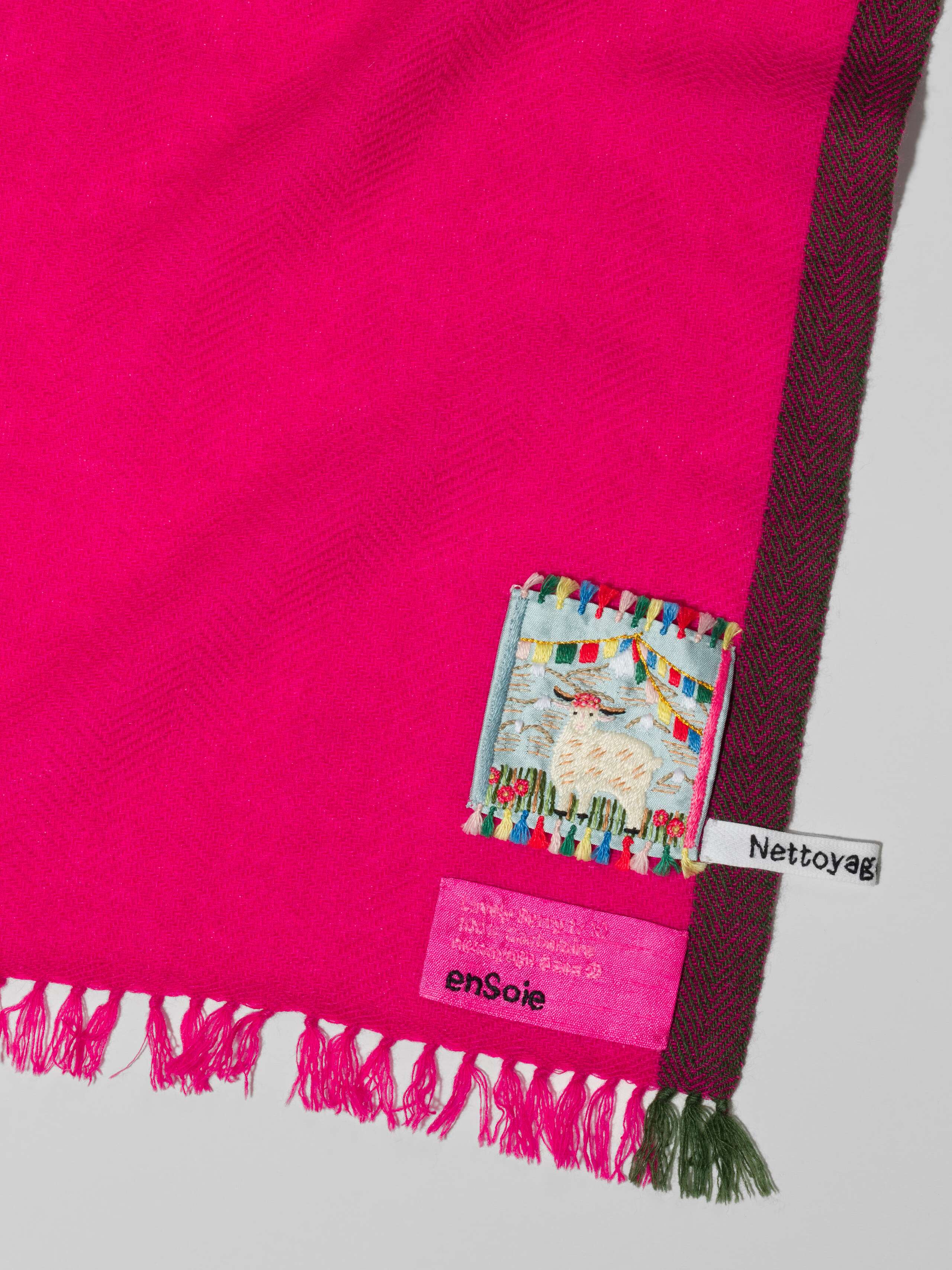 Detail Shot of Blia mini Stole in cashmere in a lovely berry pink shade