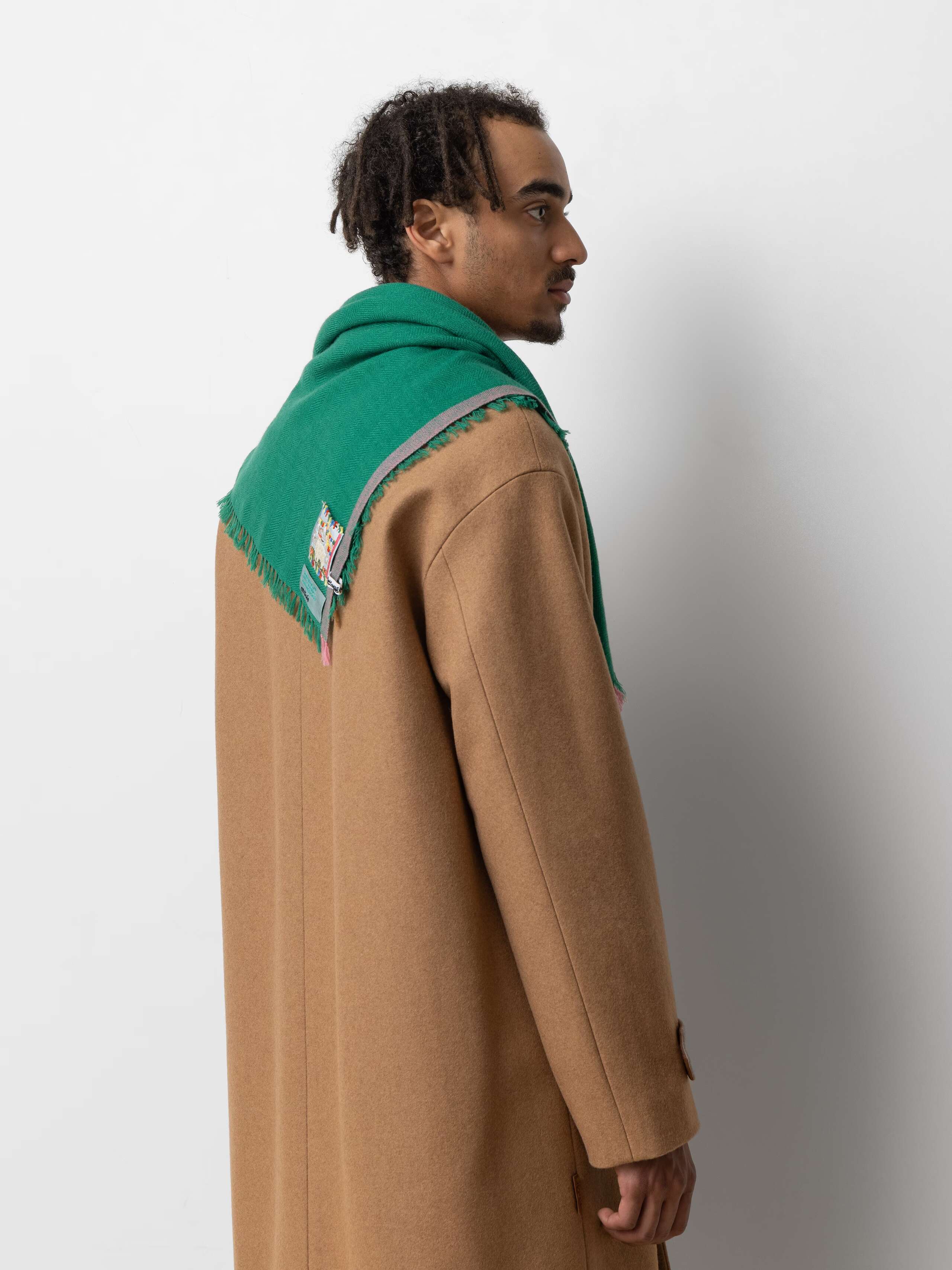 Model wearing Blia mini Cashmere stole in tropical hug green