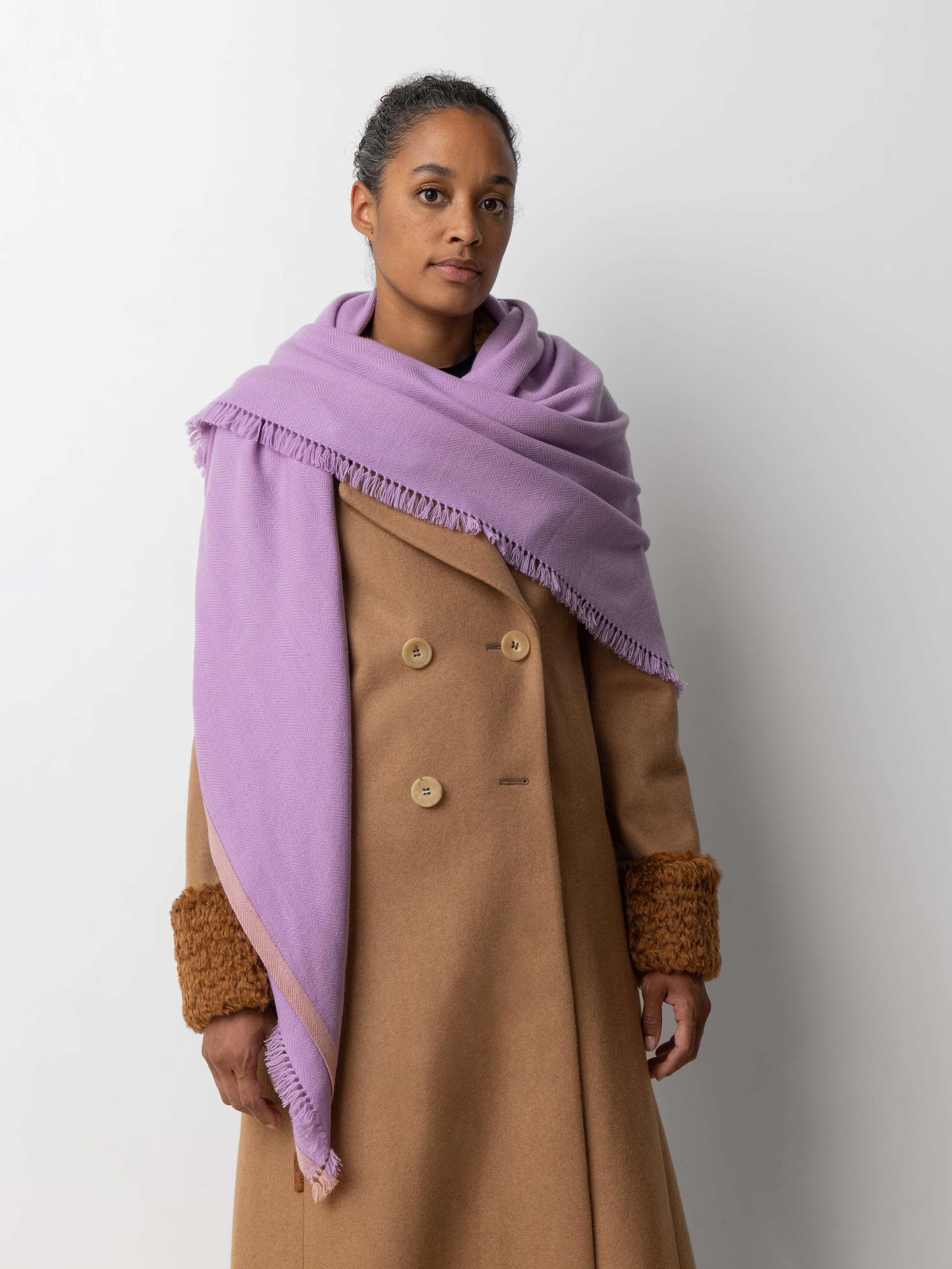 Picture of a female model wearing a purple cashmere stole