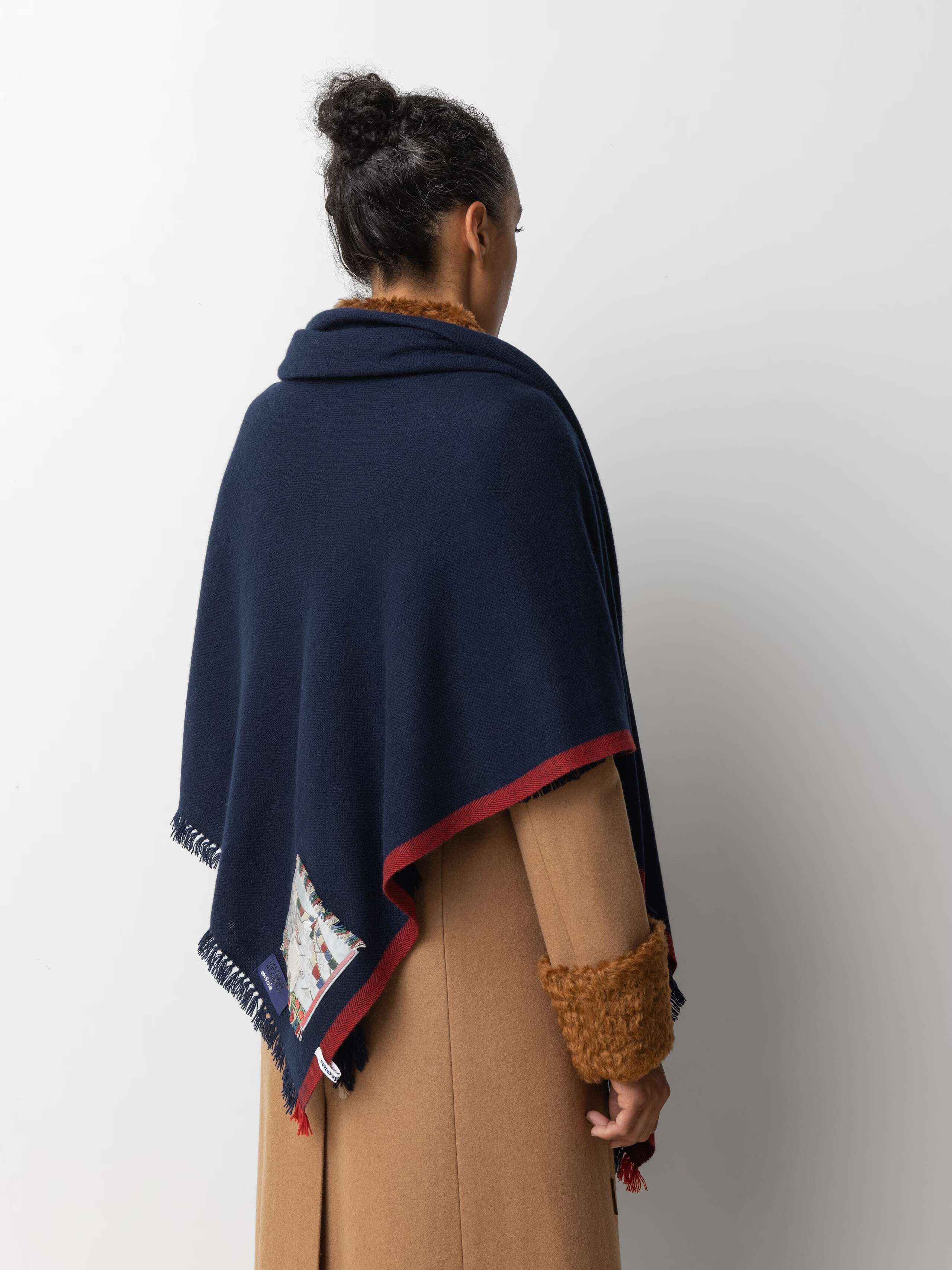 Picture of a female model wearing a navy blue cashmere stole