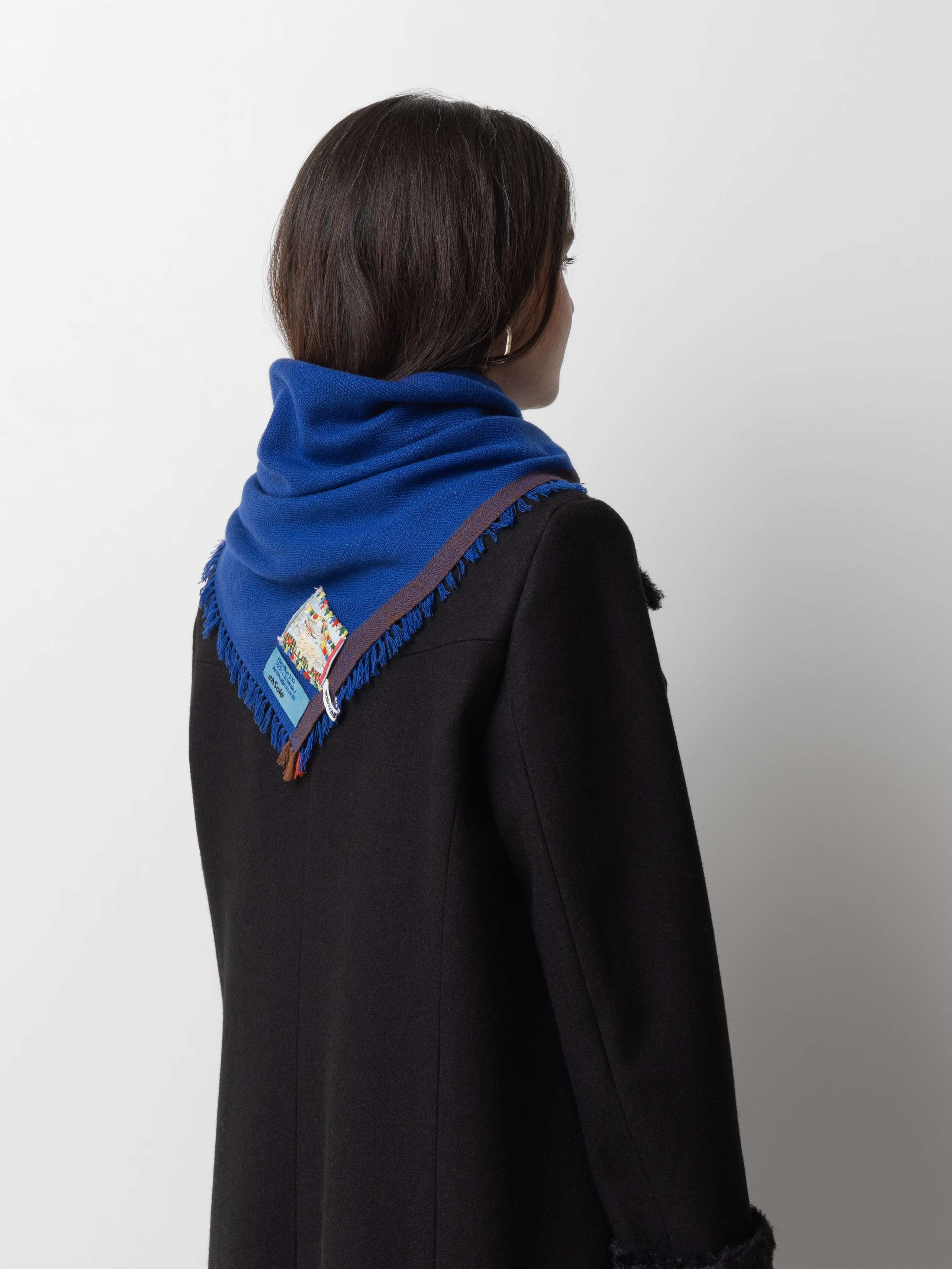Model wearing Blia mini Cashmere stole in play blue