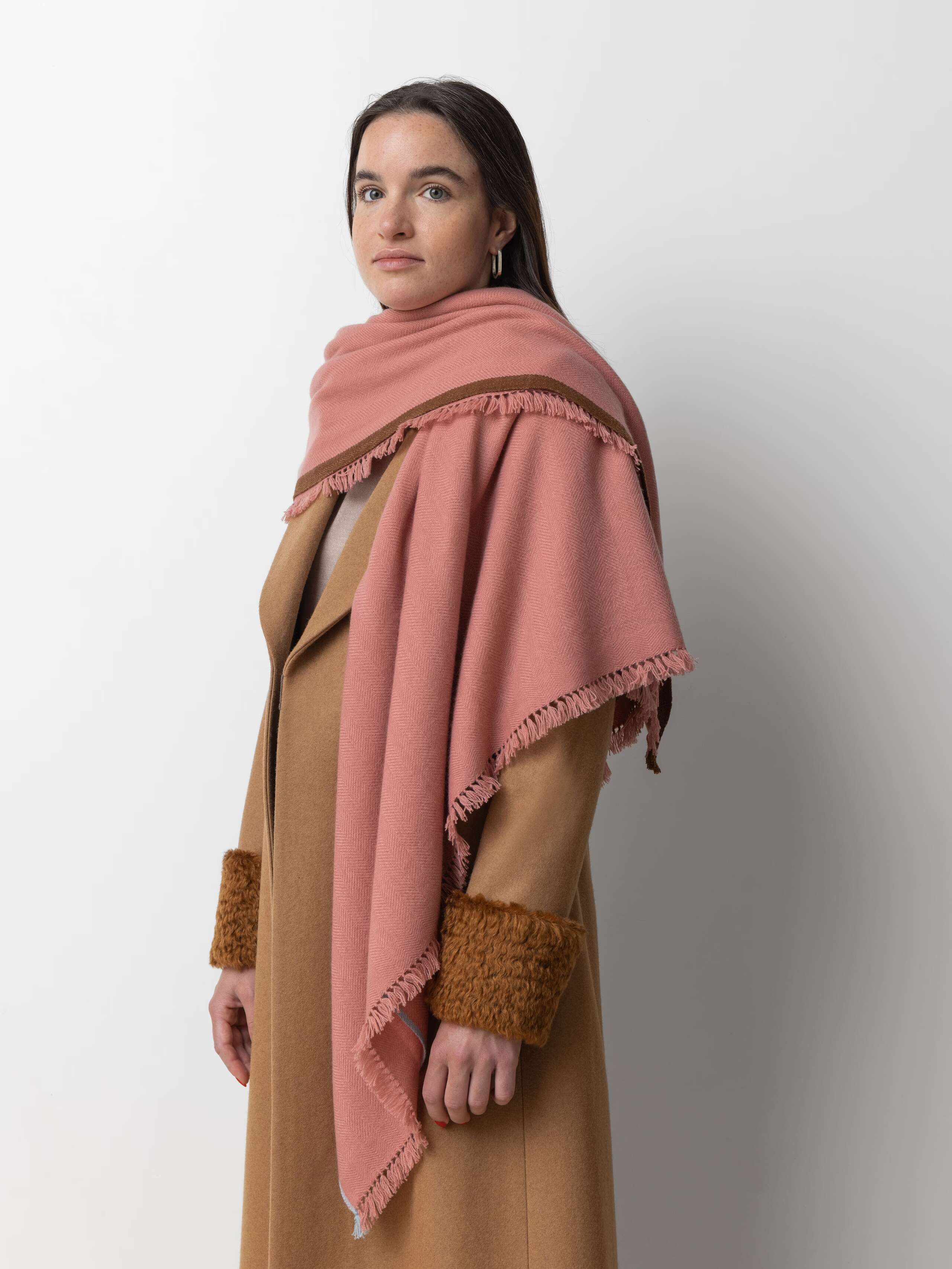 Picture of a female model wearing a pink scarf