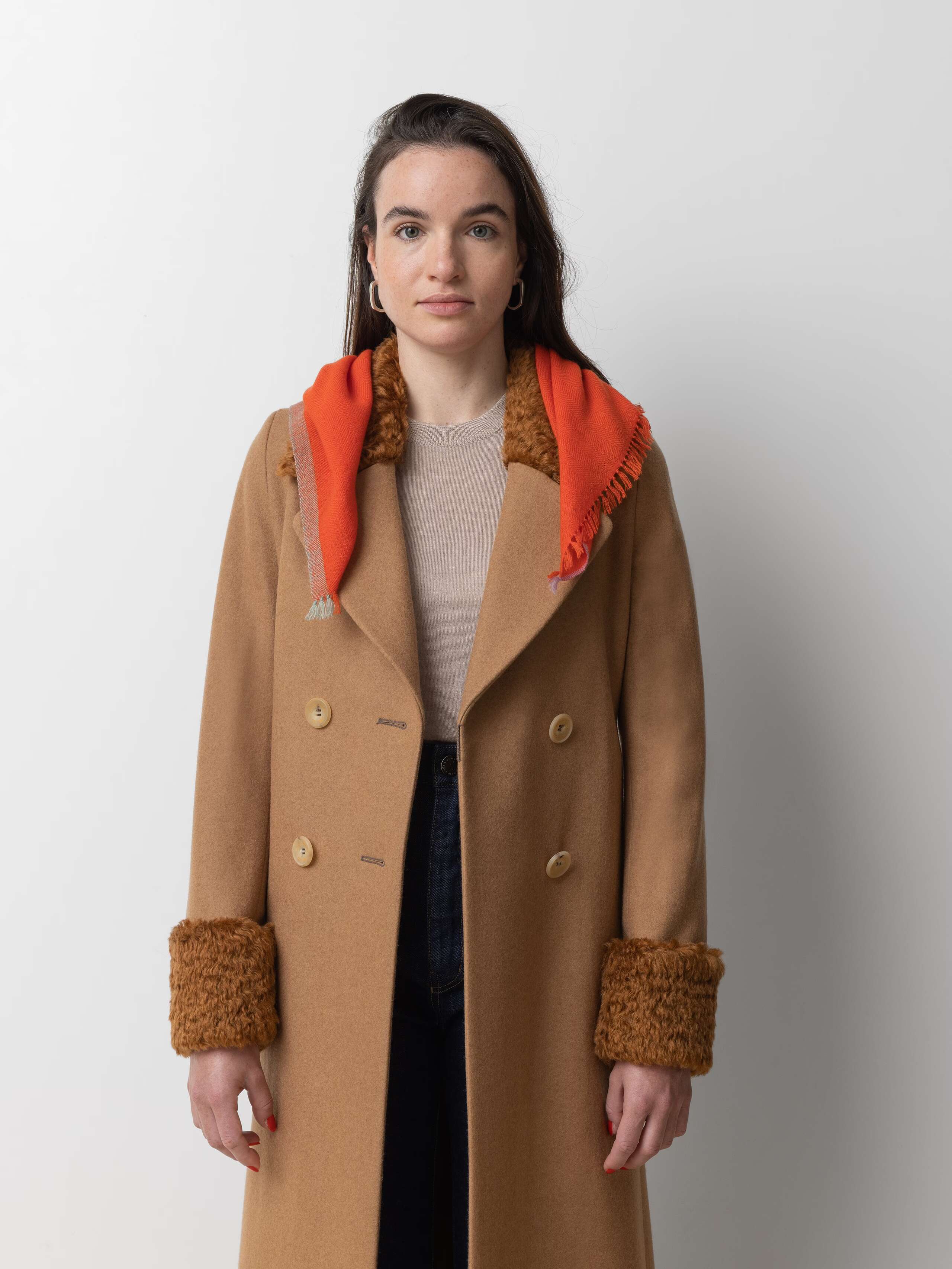 Model wearing Blia mini Cashmere stole in warmest red orange