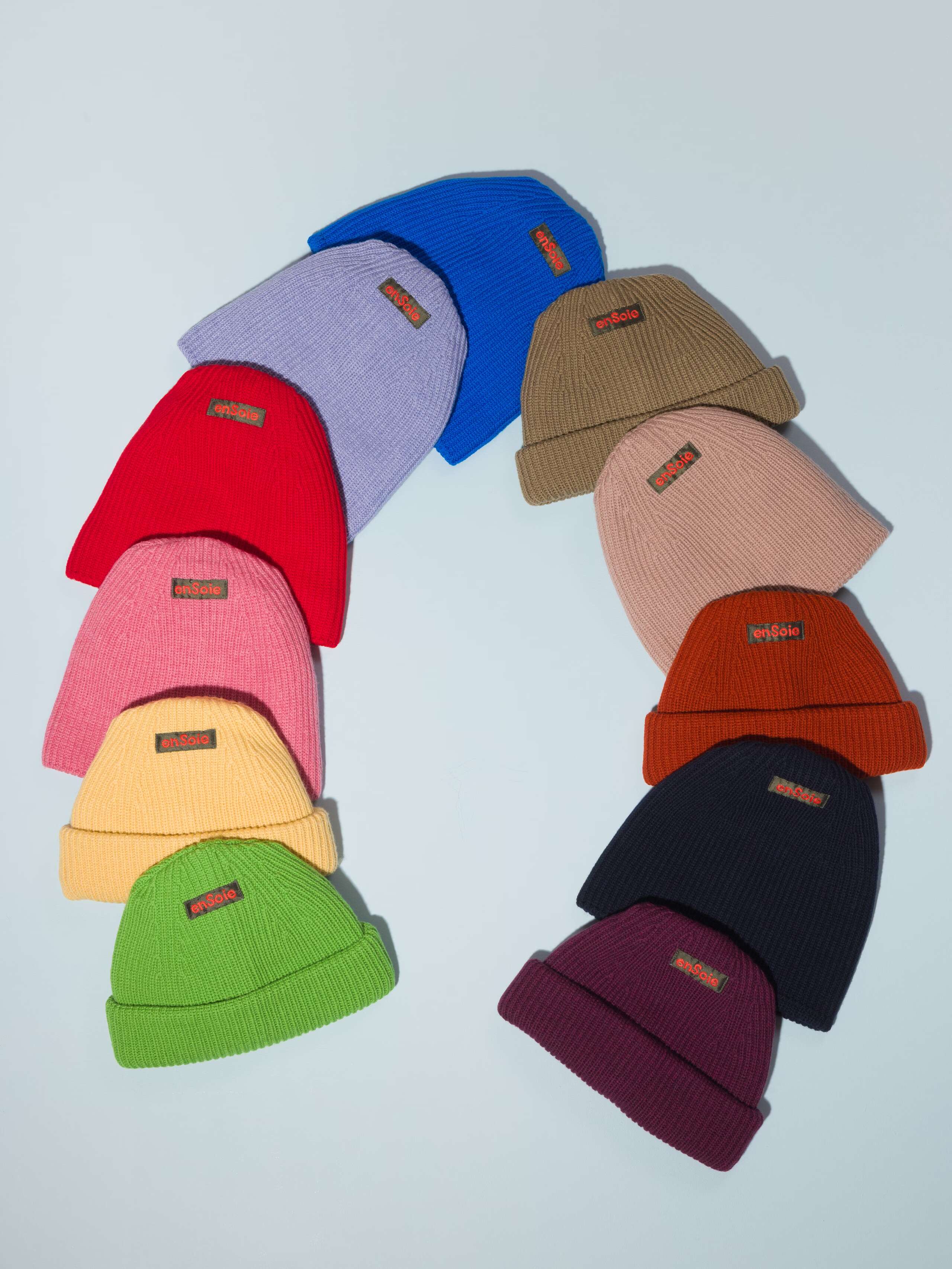 Picture of eleven colourful merino wool beanies