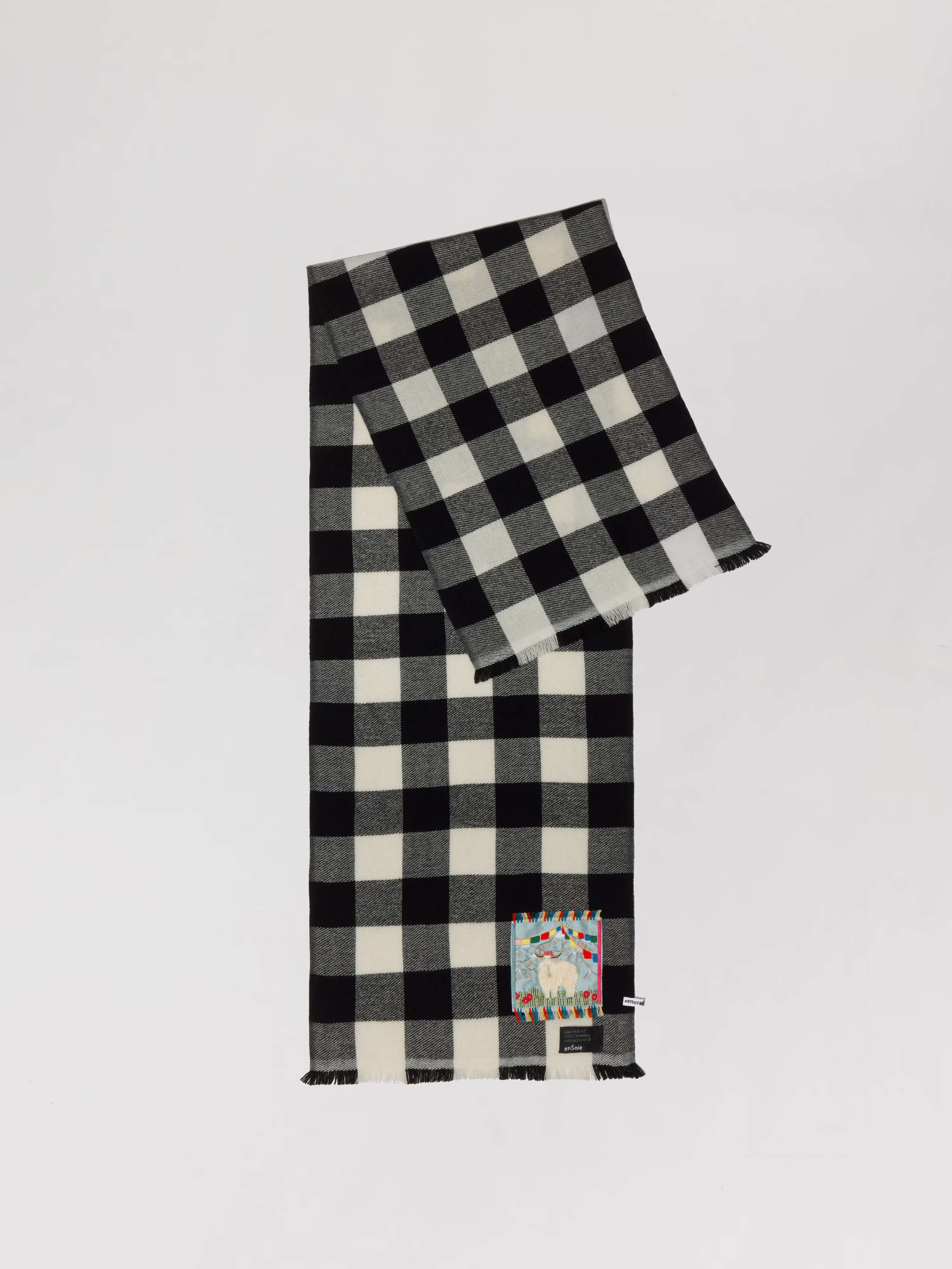 Picture of a black and shite checked cashmere scarf