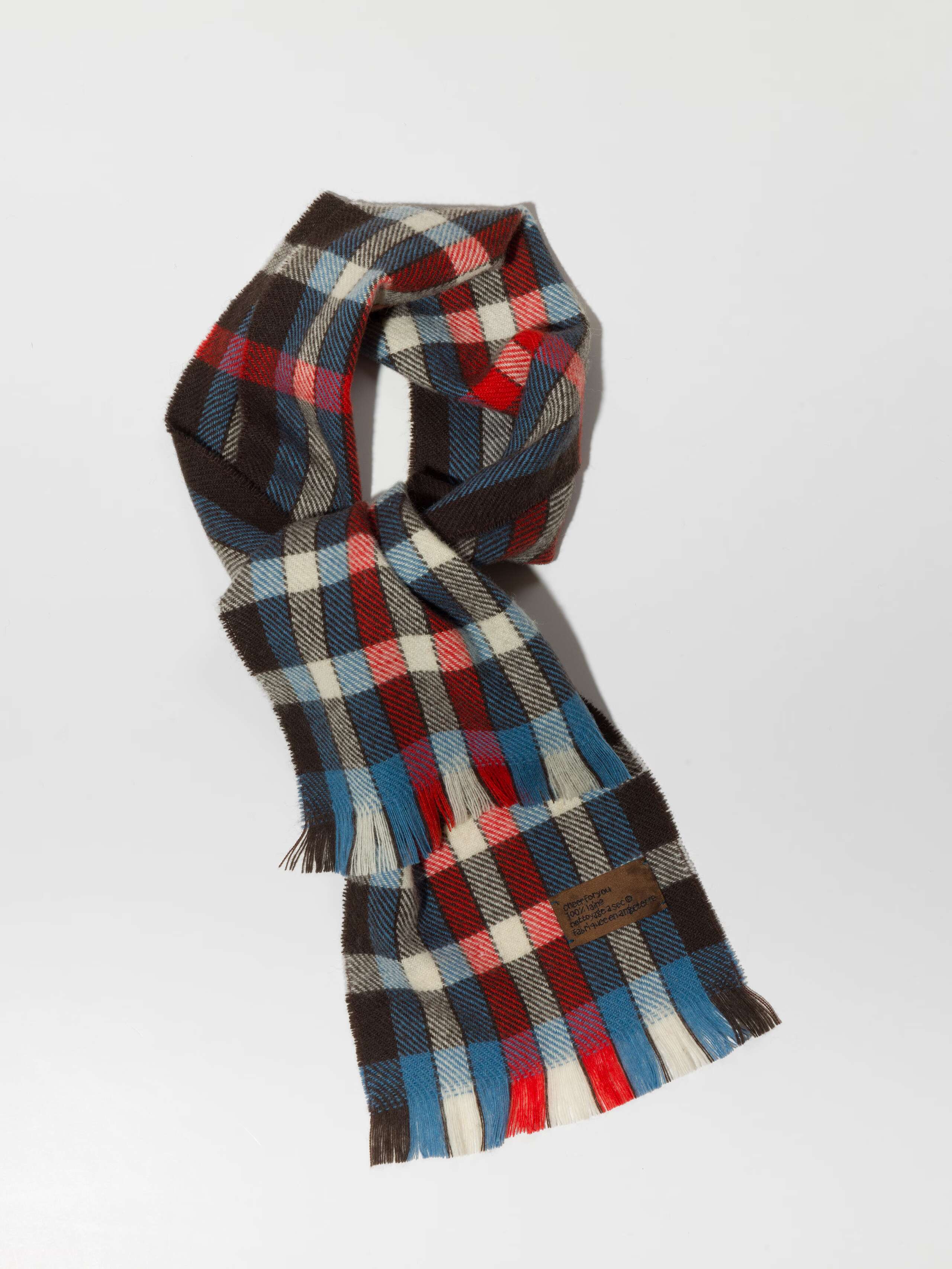 Picture of a checkered scarf in black, red, blue and white