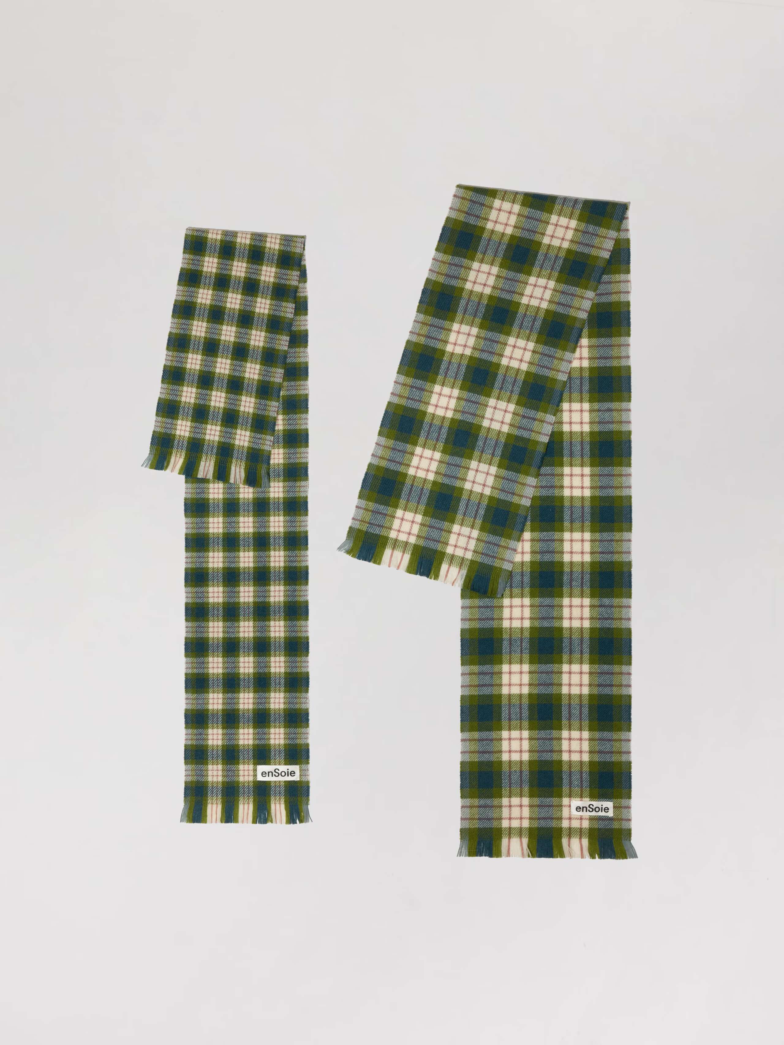 Picture of two greenish wool scarfs