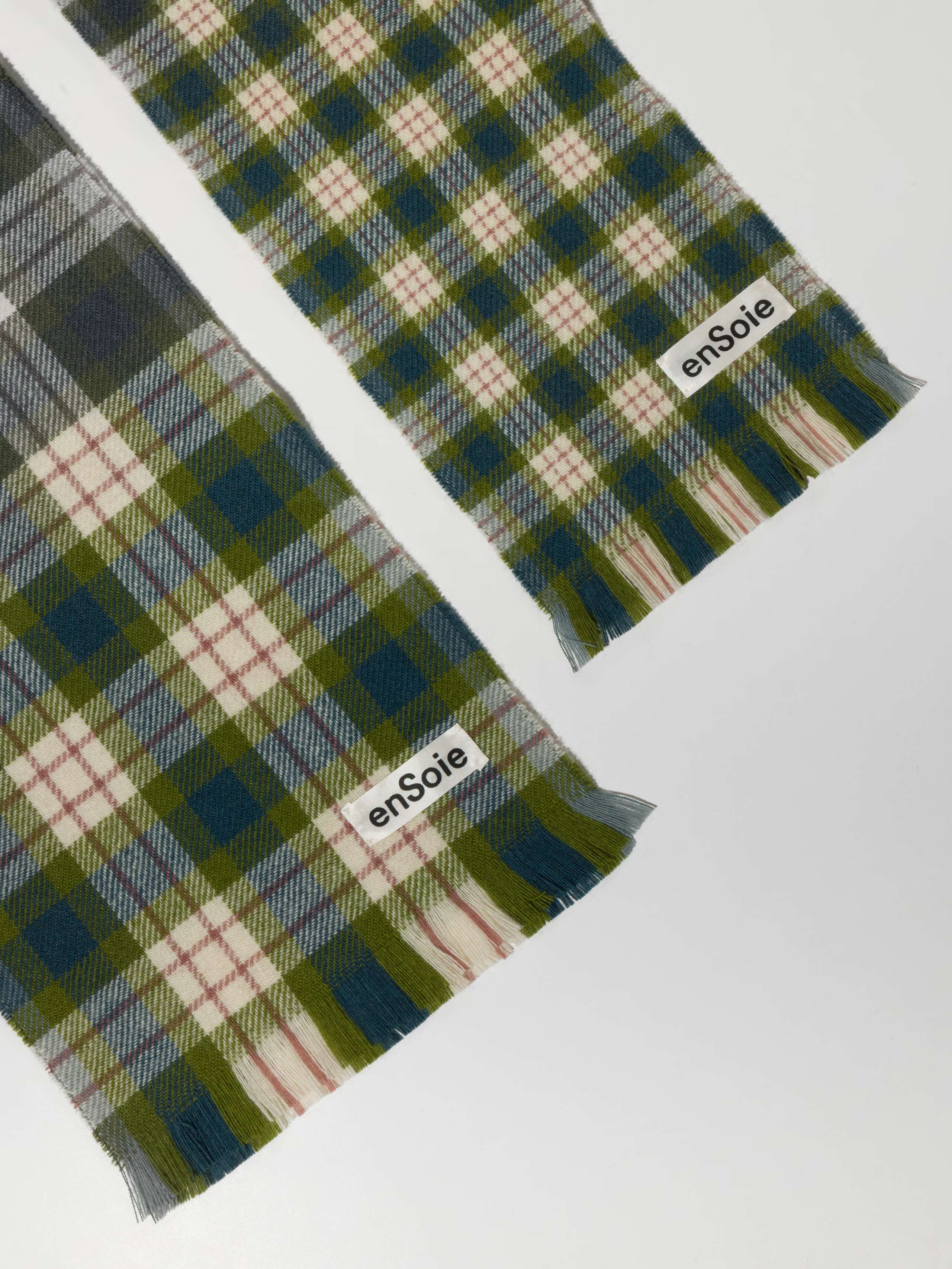 Picture of two greenish wool scarfs