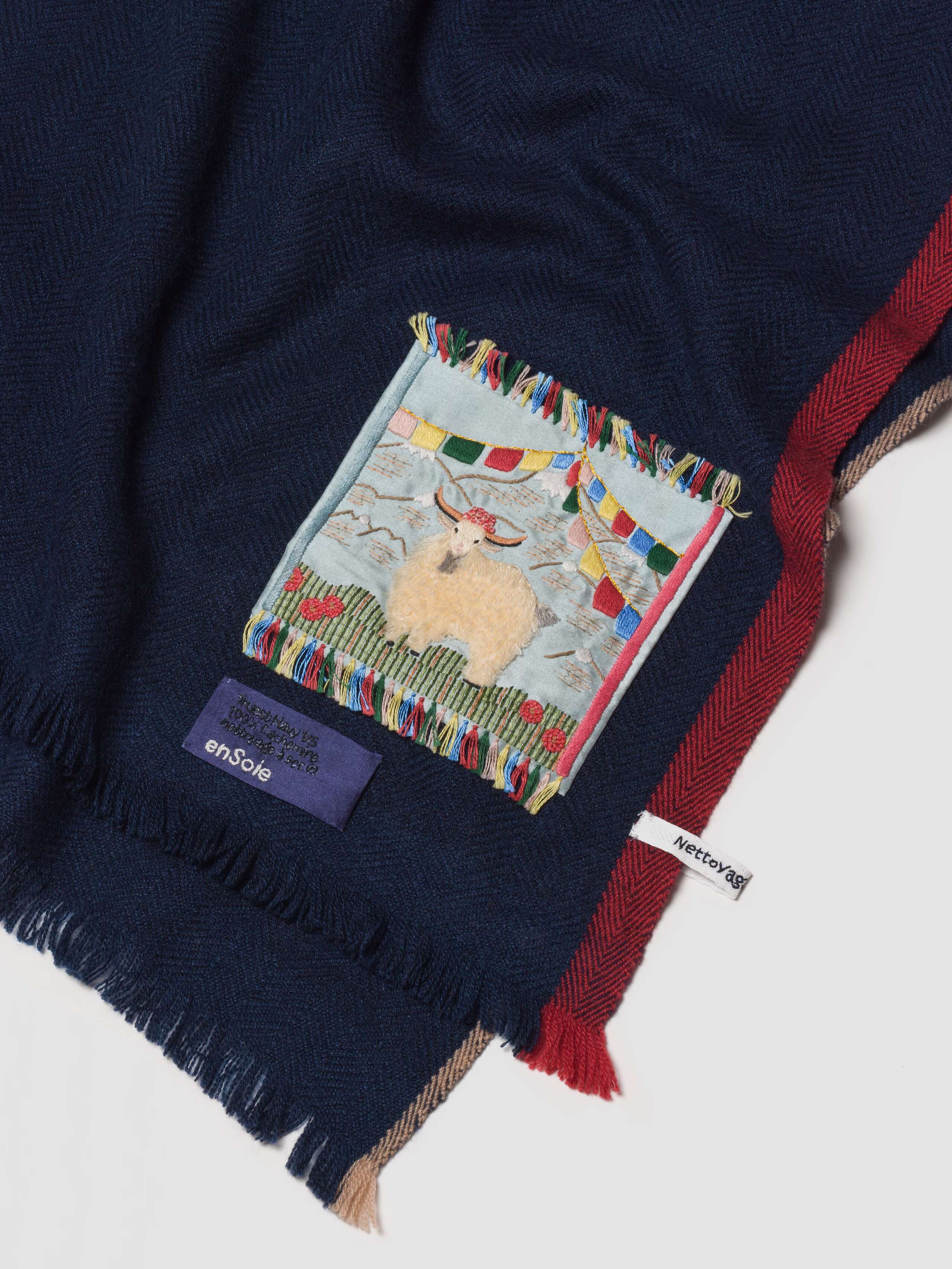 Picture of a detail of a navy blue cashmere stole