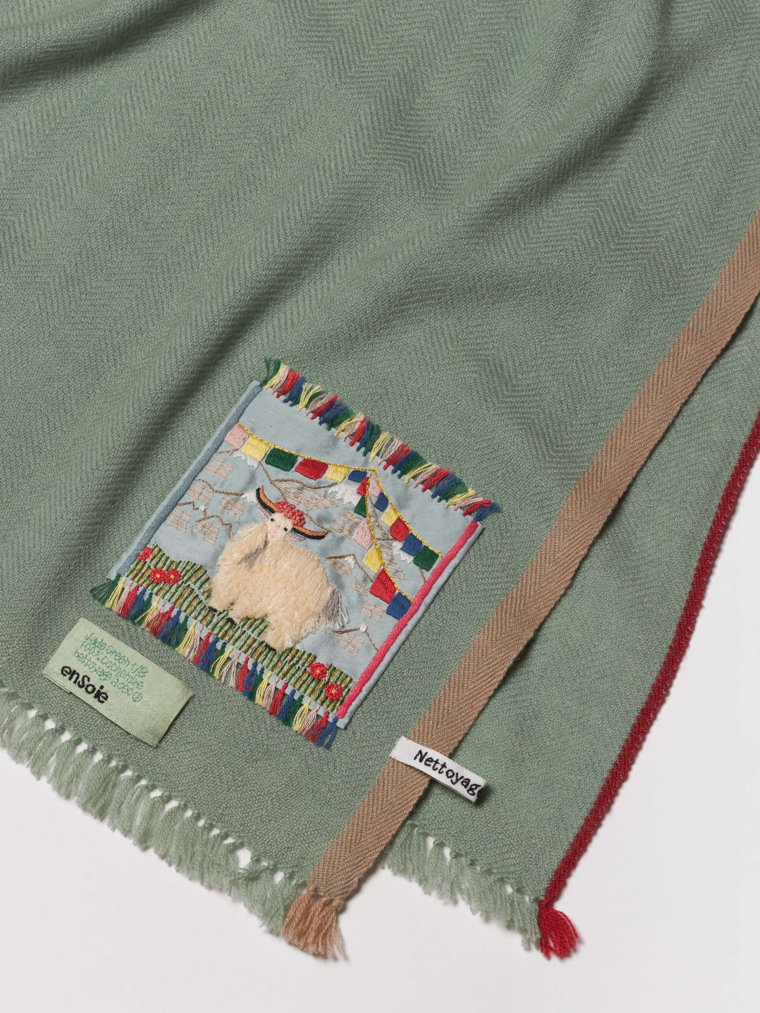 Picture of a detail of a light green blue cashmere stole